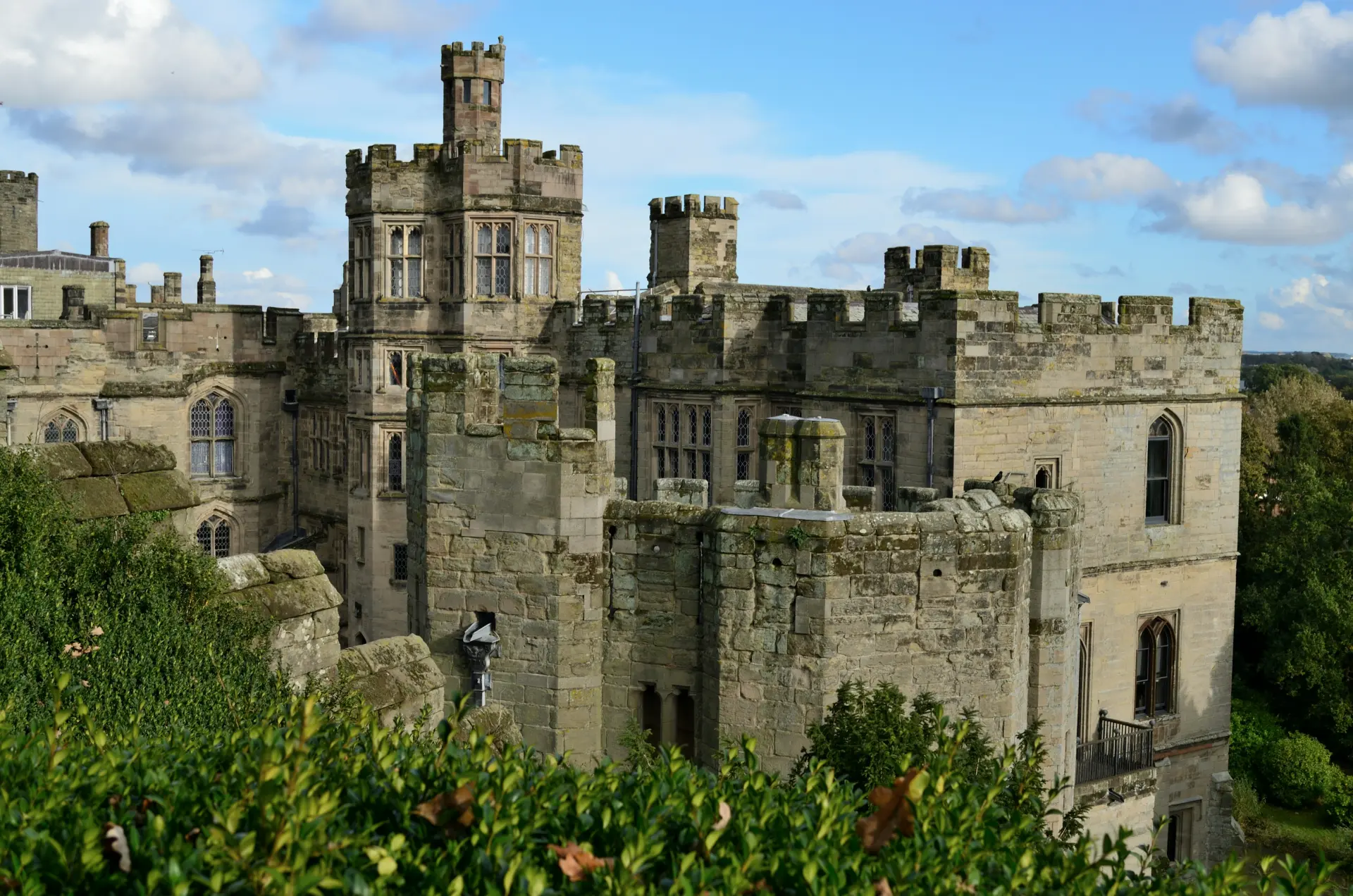 a stone castle with a person standing on top of it