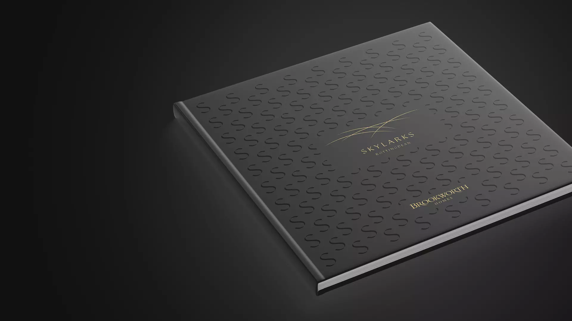 a black book with a gold logo