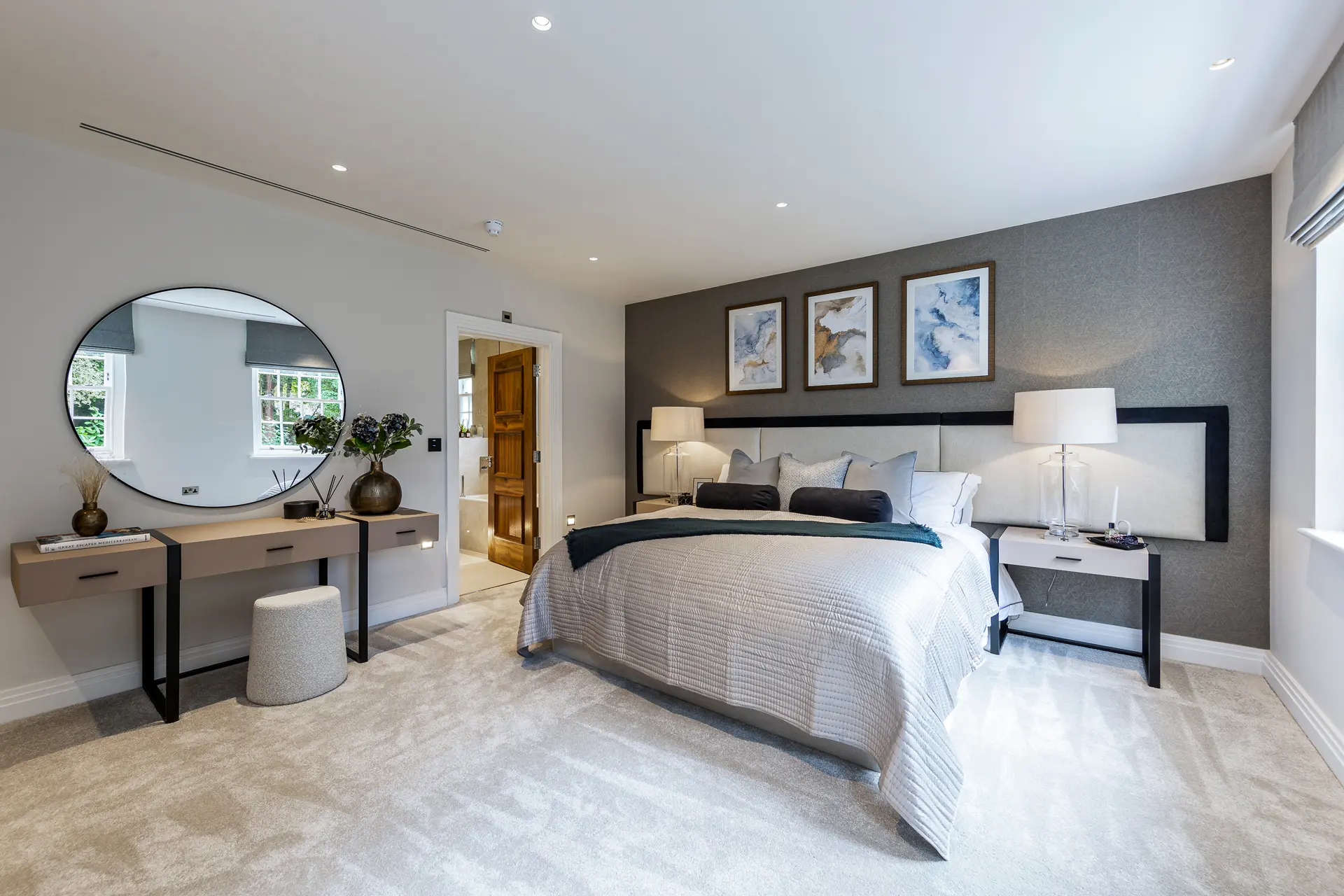 a bedroom with a mirror and a bed
