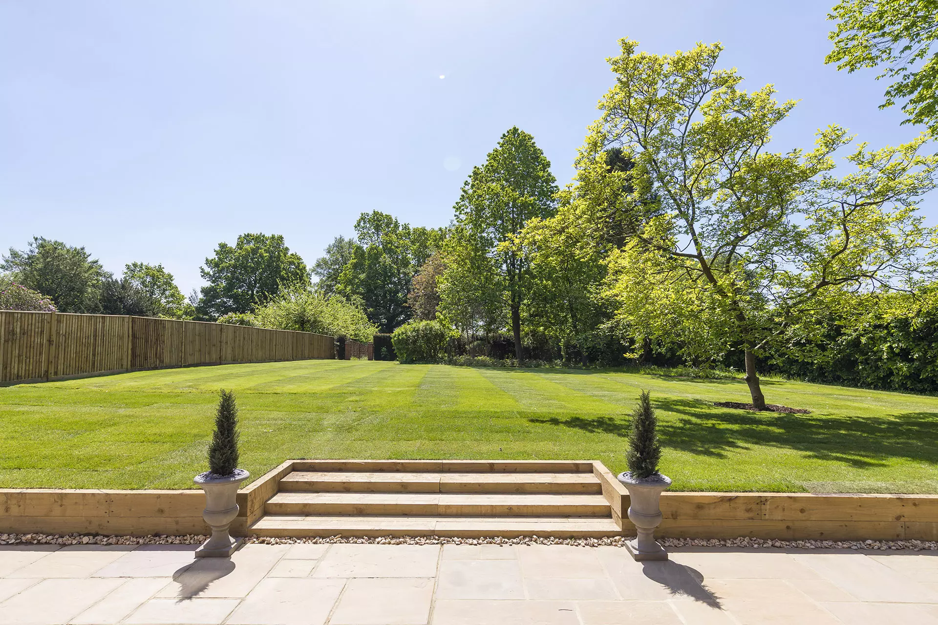 a backyard with a lawn and trees