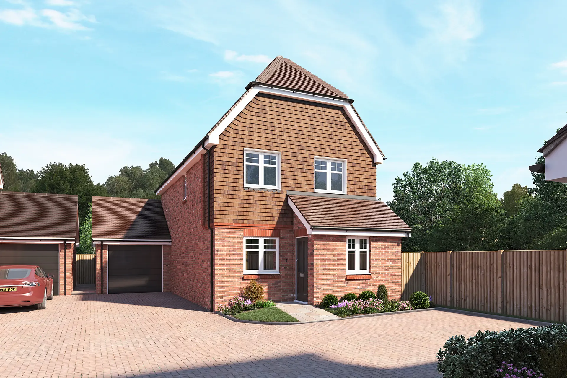 a brick house with a driveway and a fence