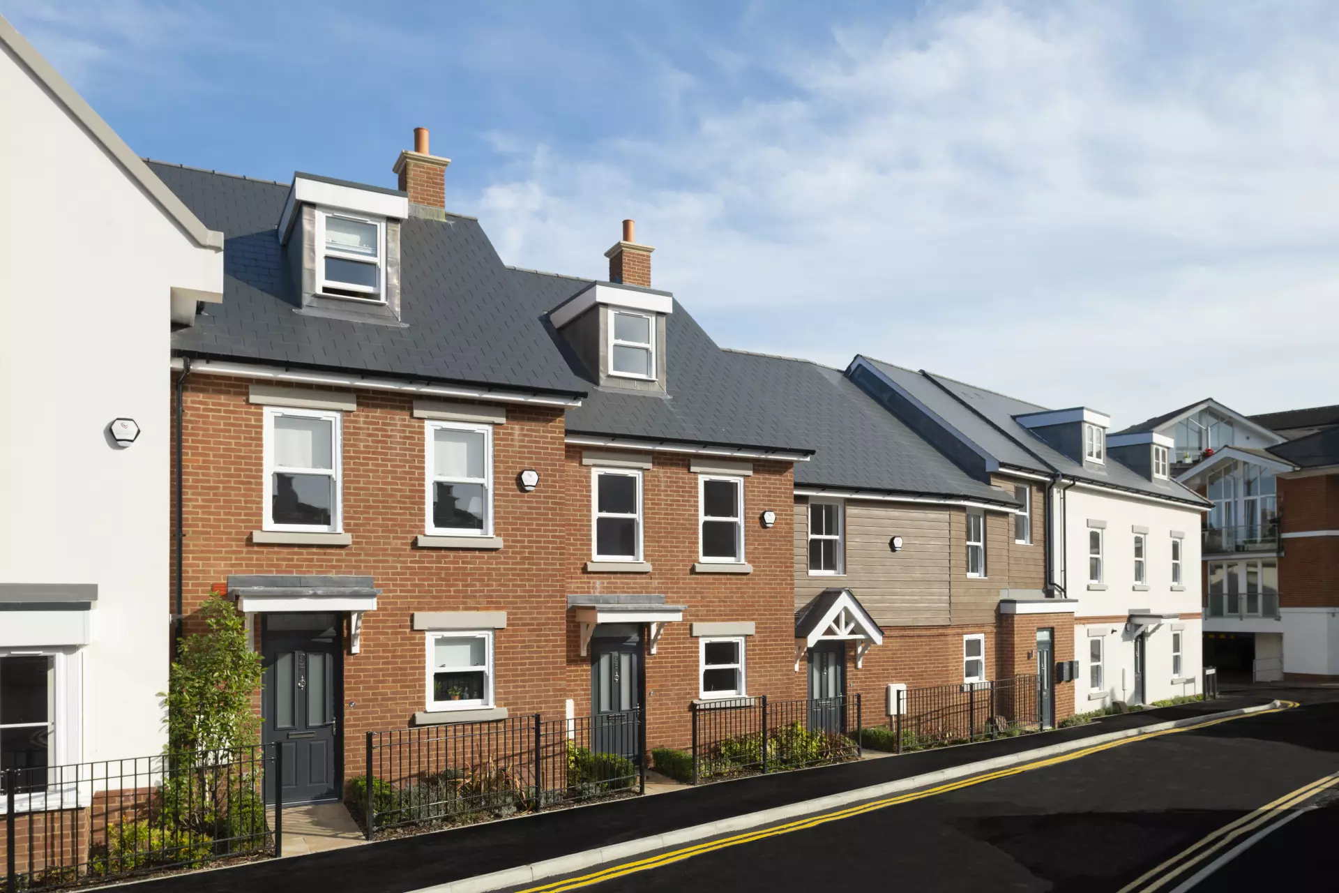 a row of houses with a fence