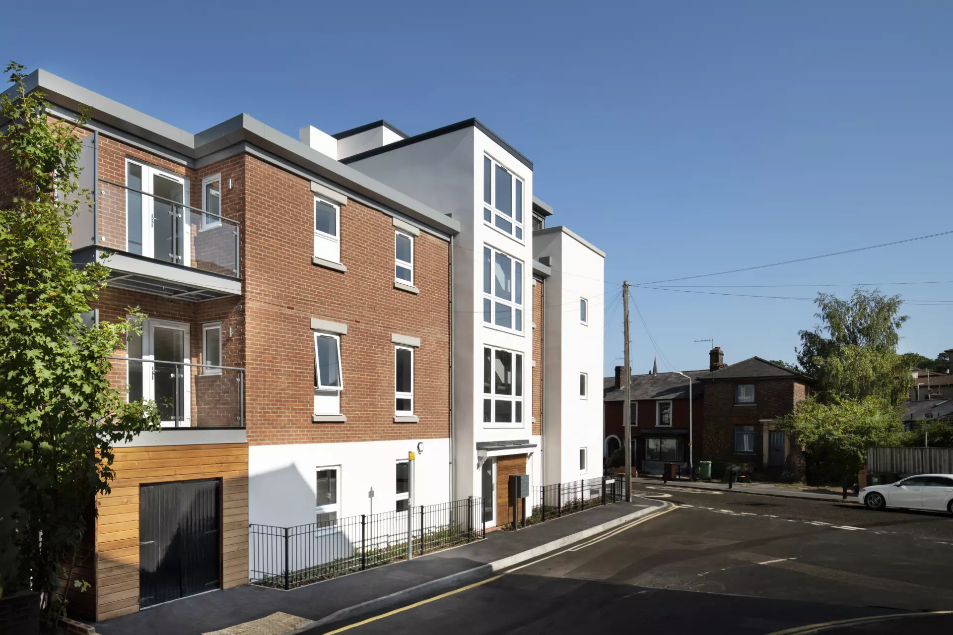 a building with a fence and a street