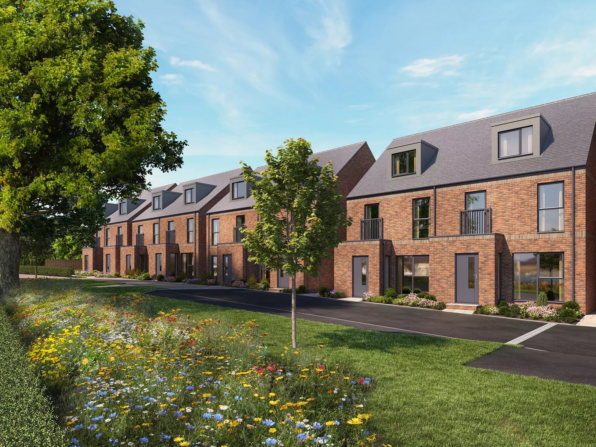 a row of brick houses with trees and grass