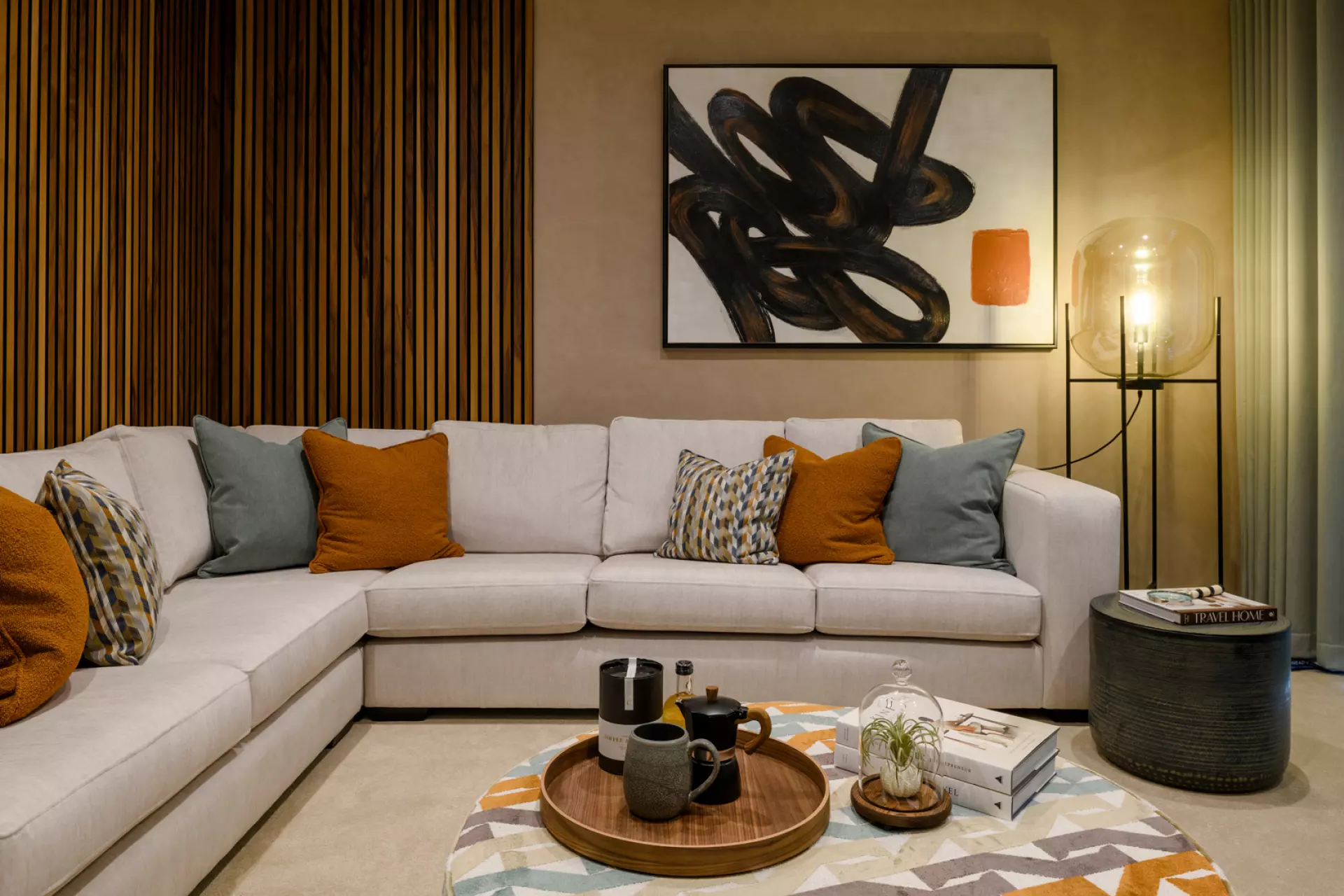 a living room with a couch and art