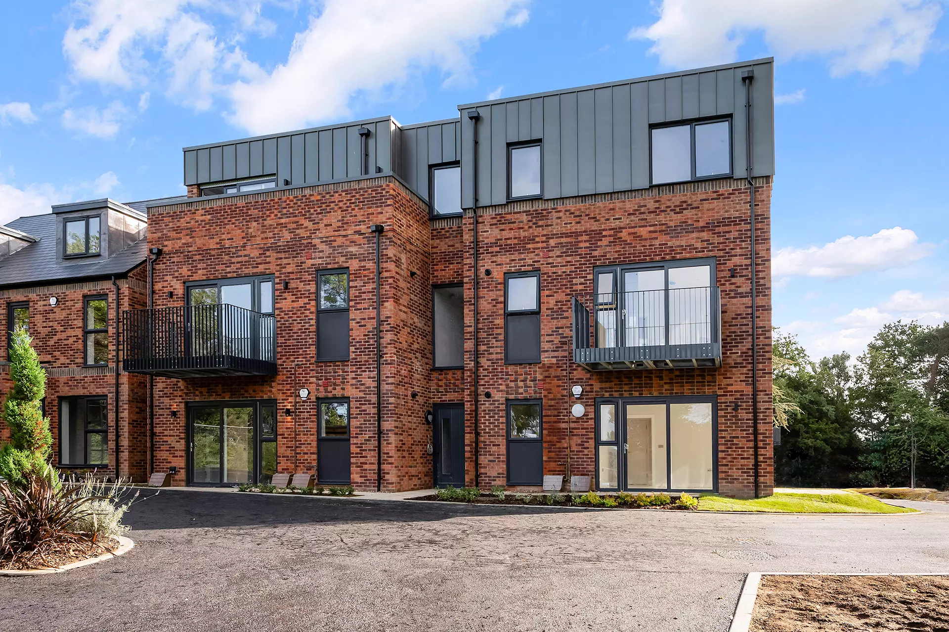 a brick building with a parking lot