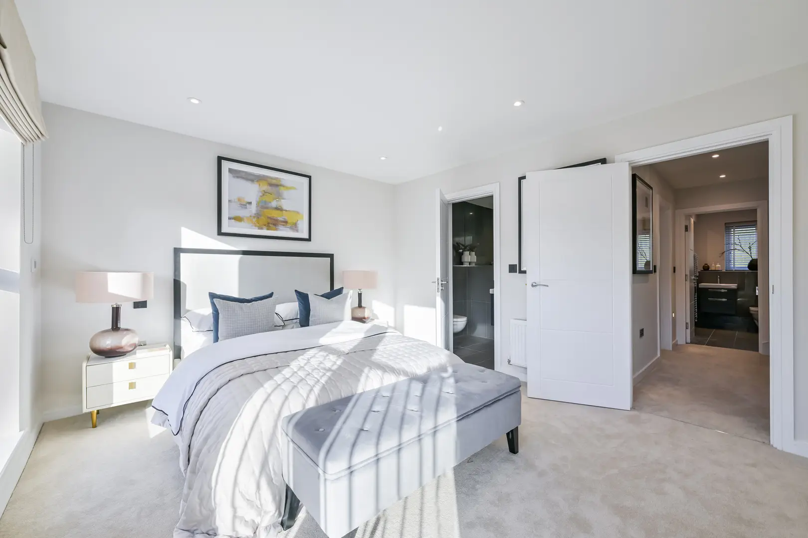 a bedroom with a bed and a white door