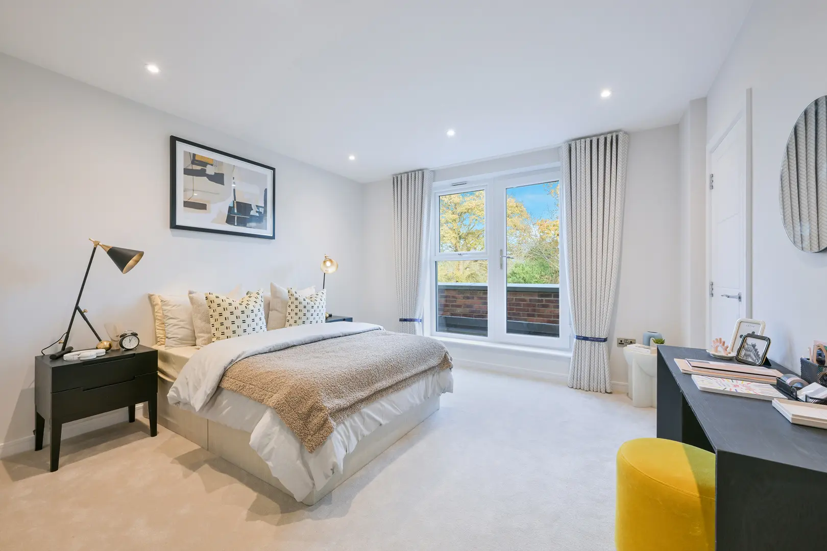 a bedroom with a bed and a table