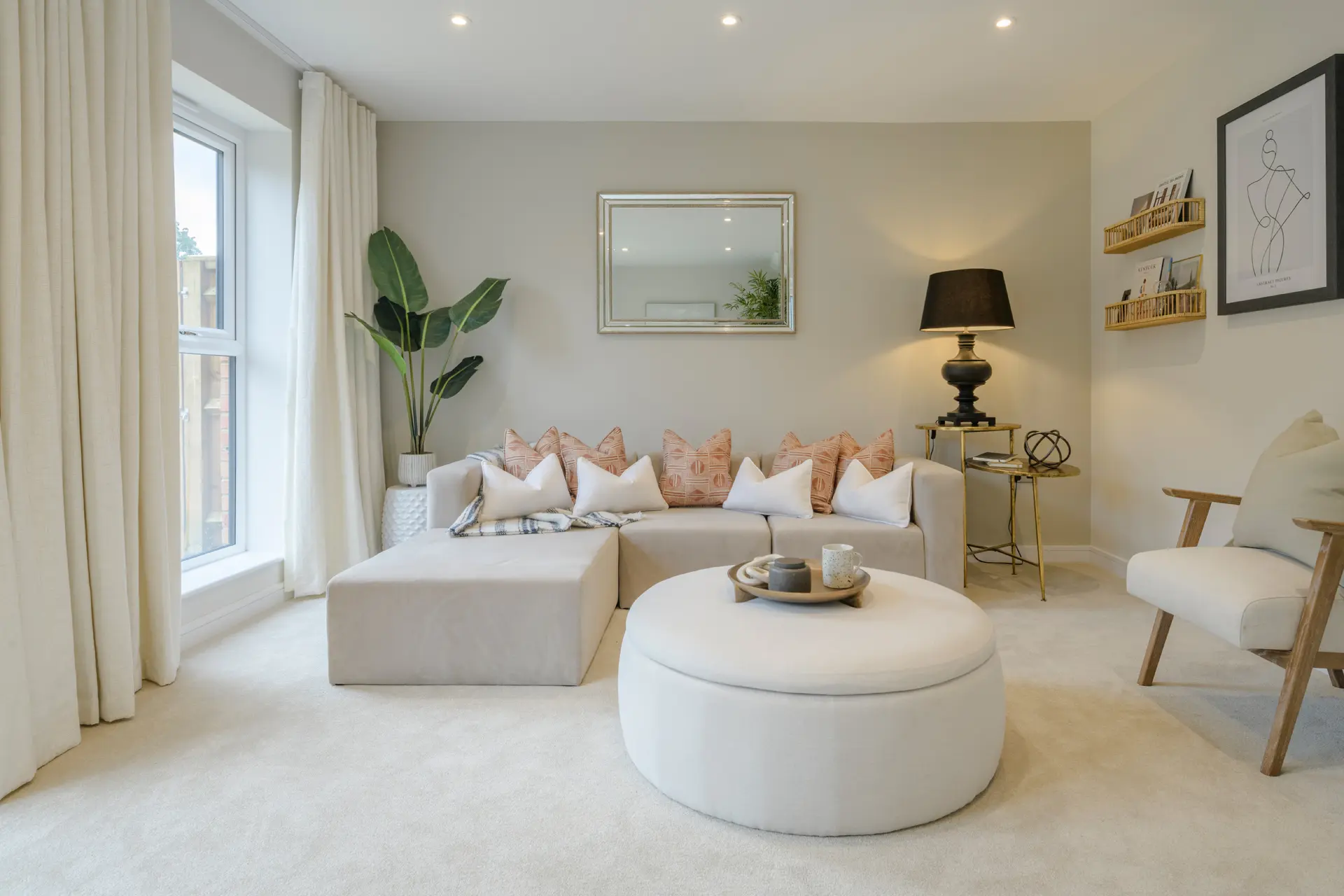 a living room with a large couch and a large mirror