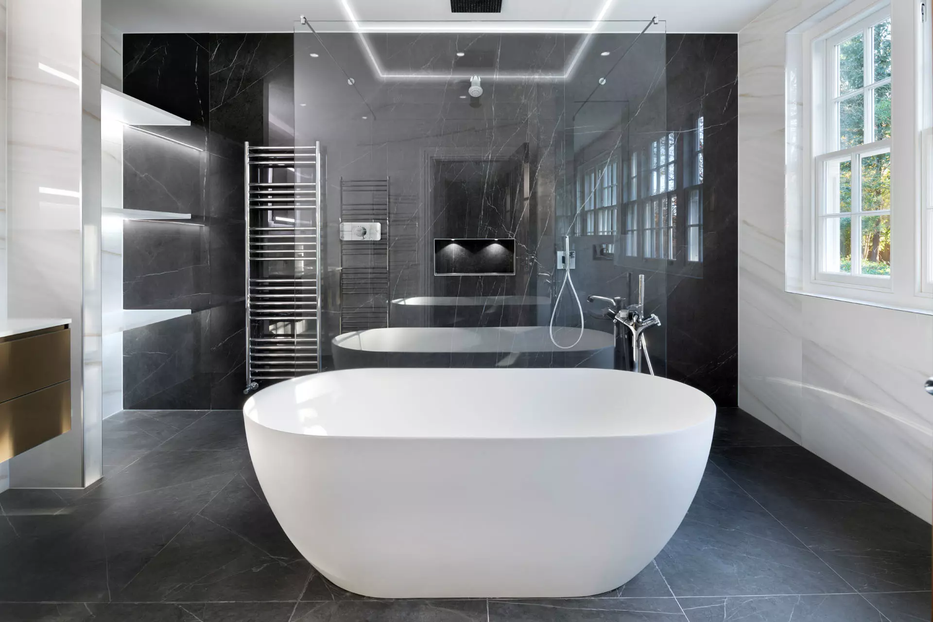 a bathroom with a tub and a shower