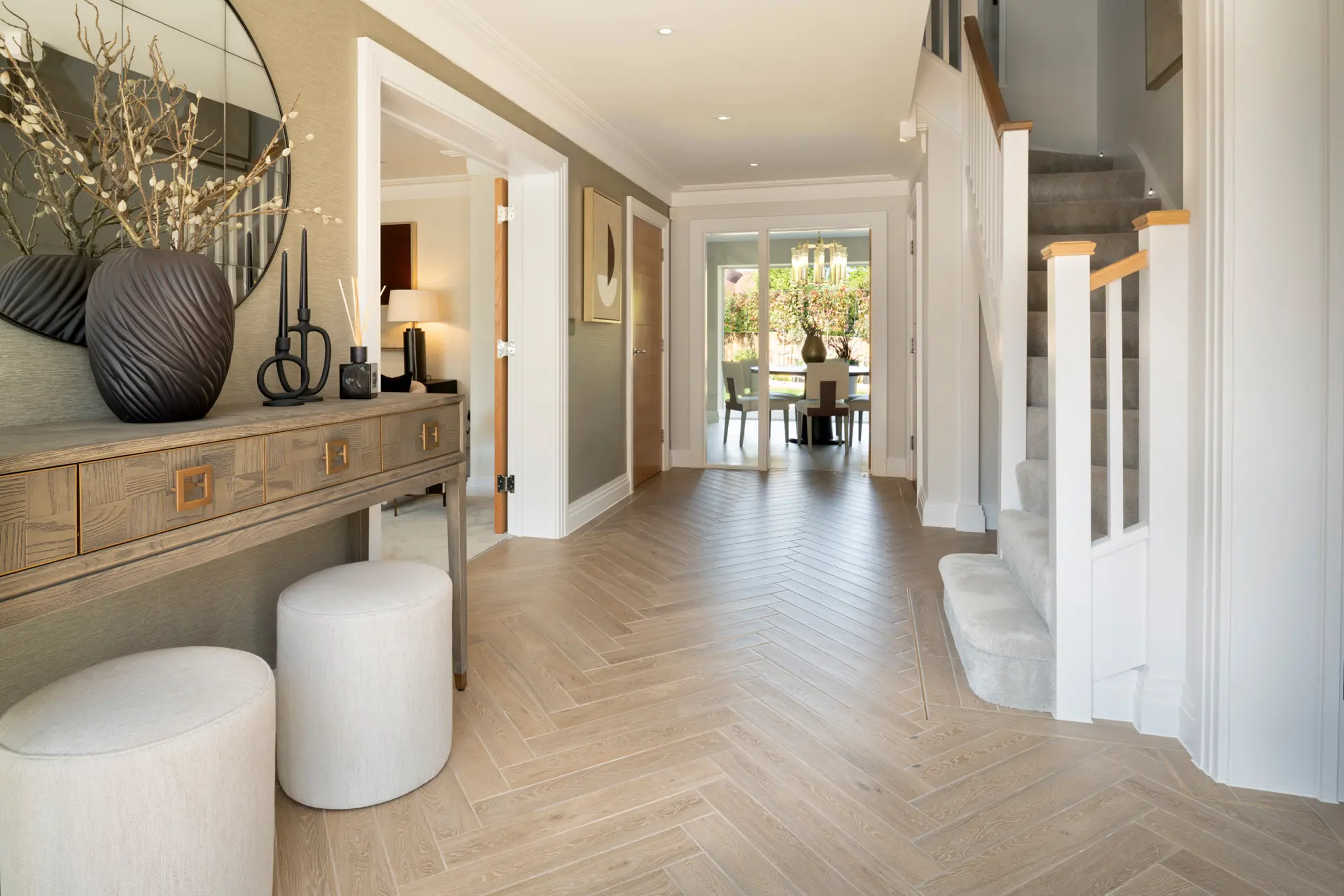 a hallway with a mirror and a table