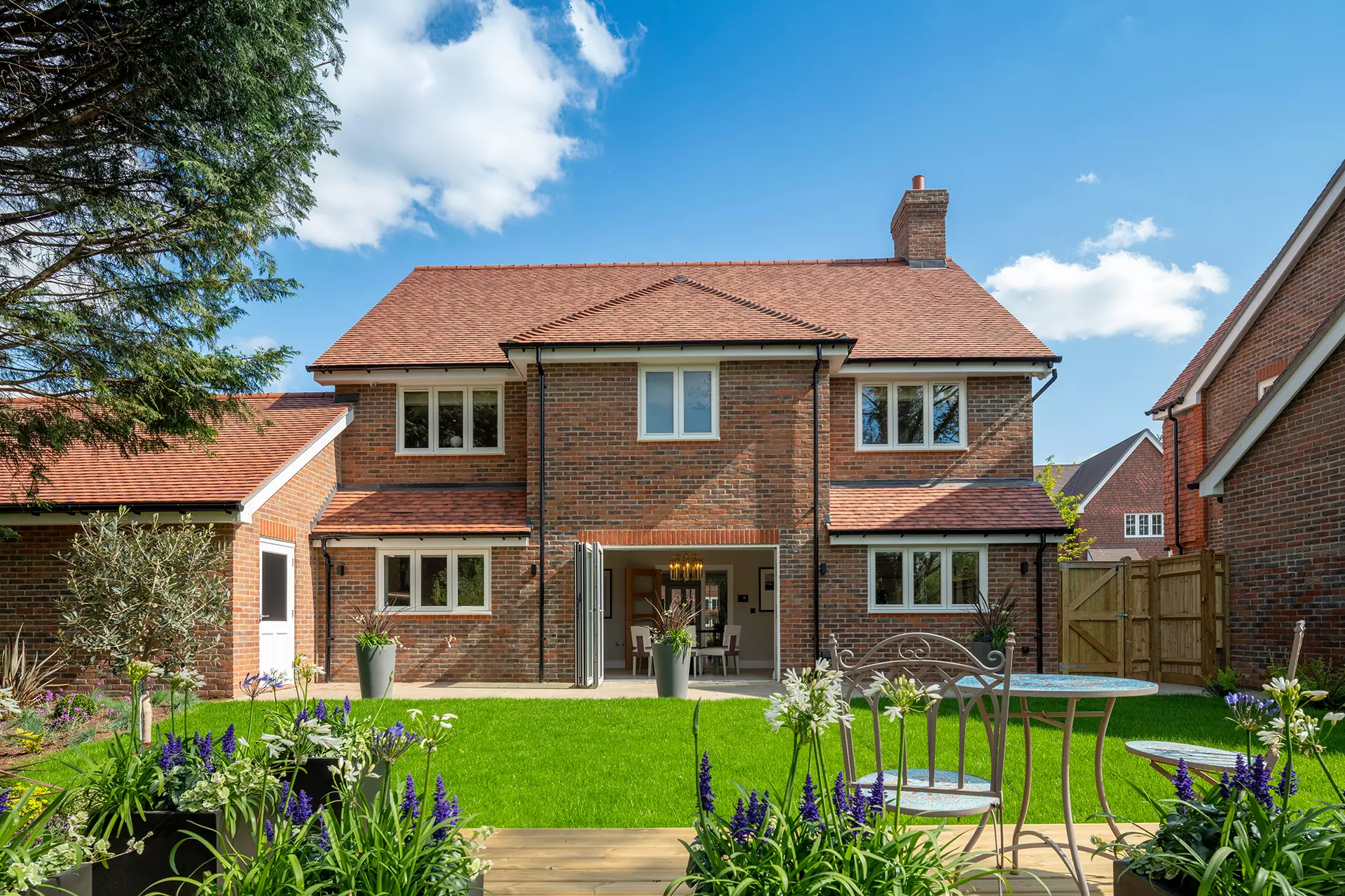 a house with a lawn and a patio