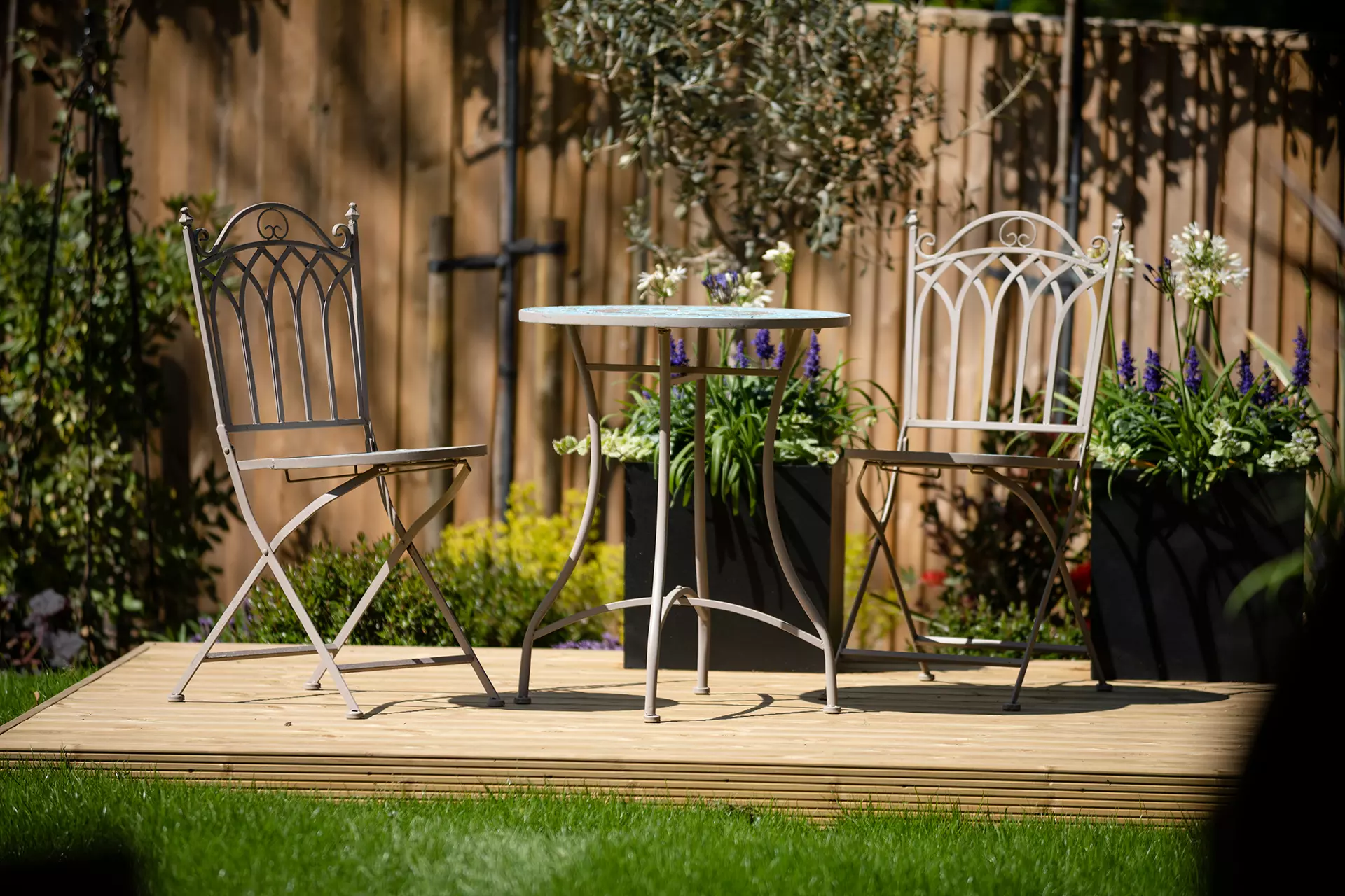 a table and chairs on a deck