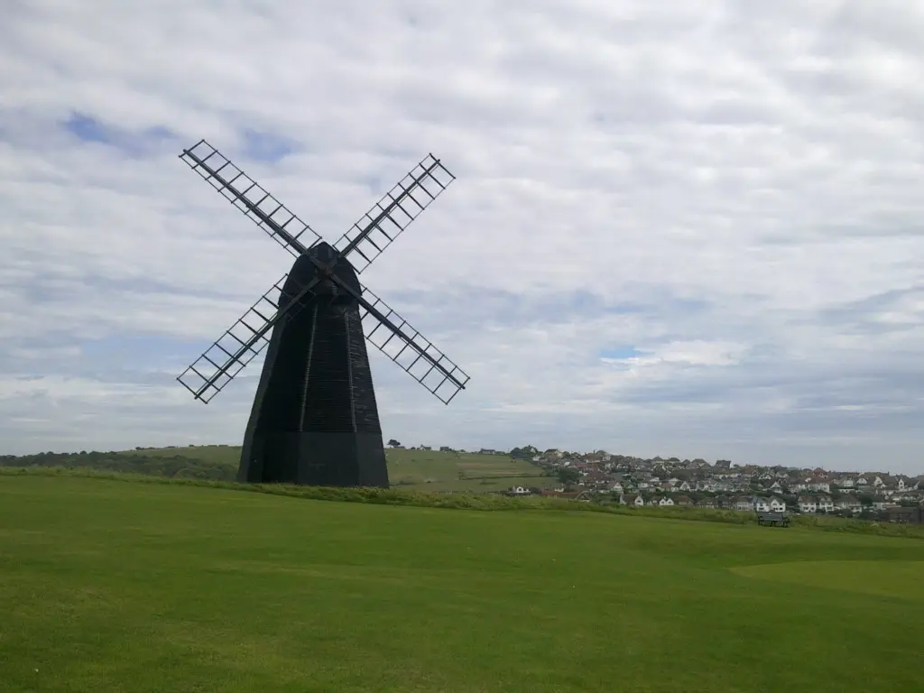 Windmill in a grassy field