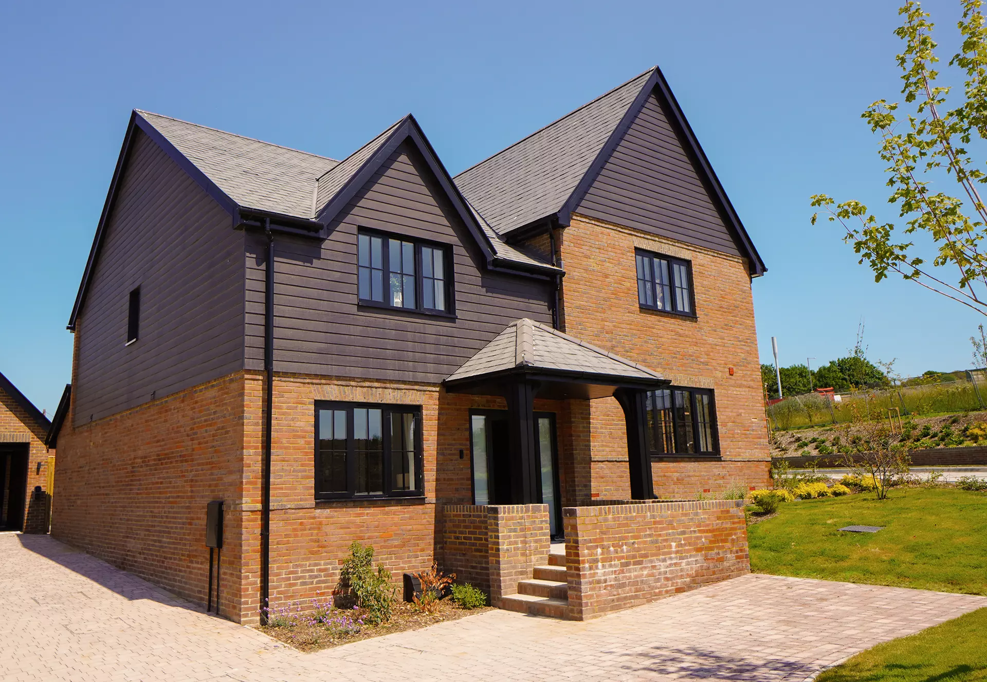 a brick house with a brick wall and a brick walkway