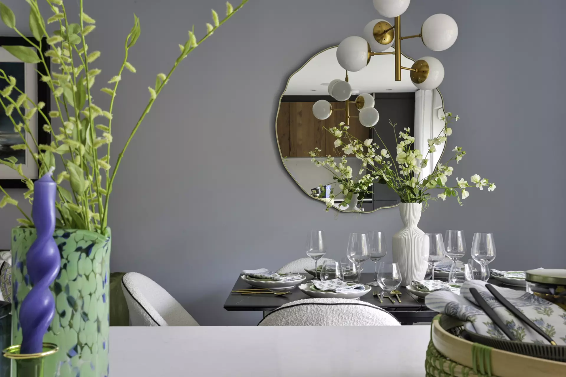 a table with a vase of flowers on it