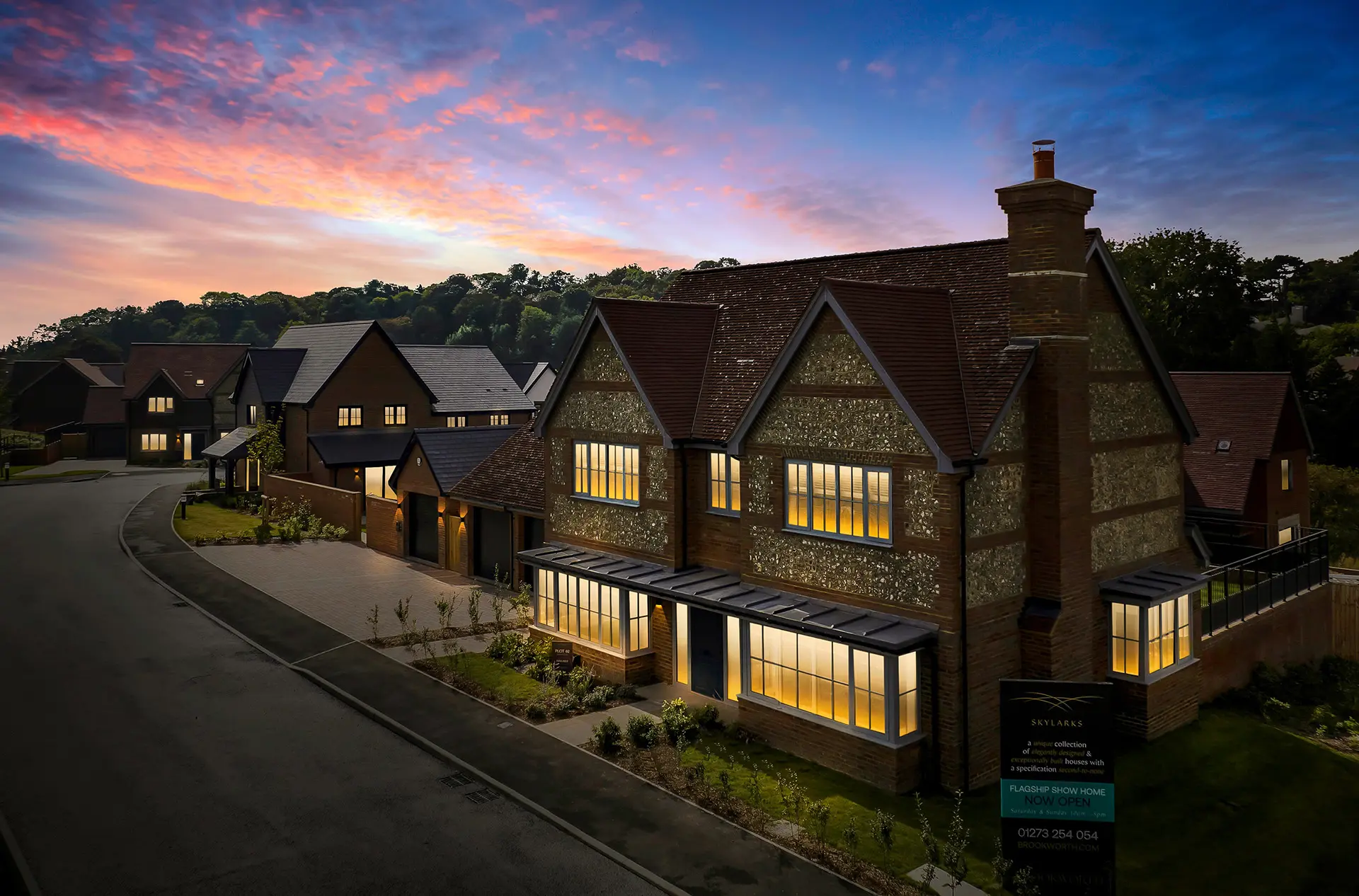 a row of houses with trees in the background
