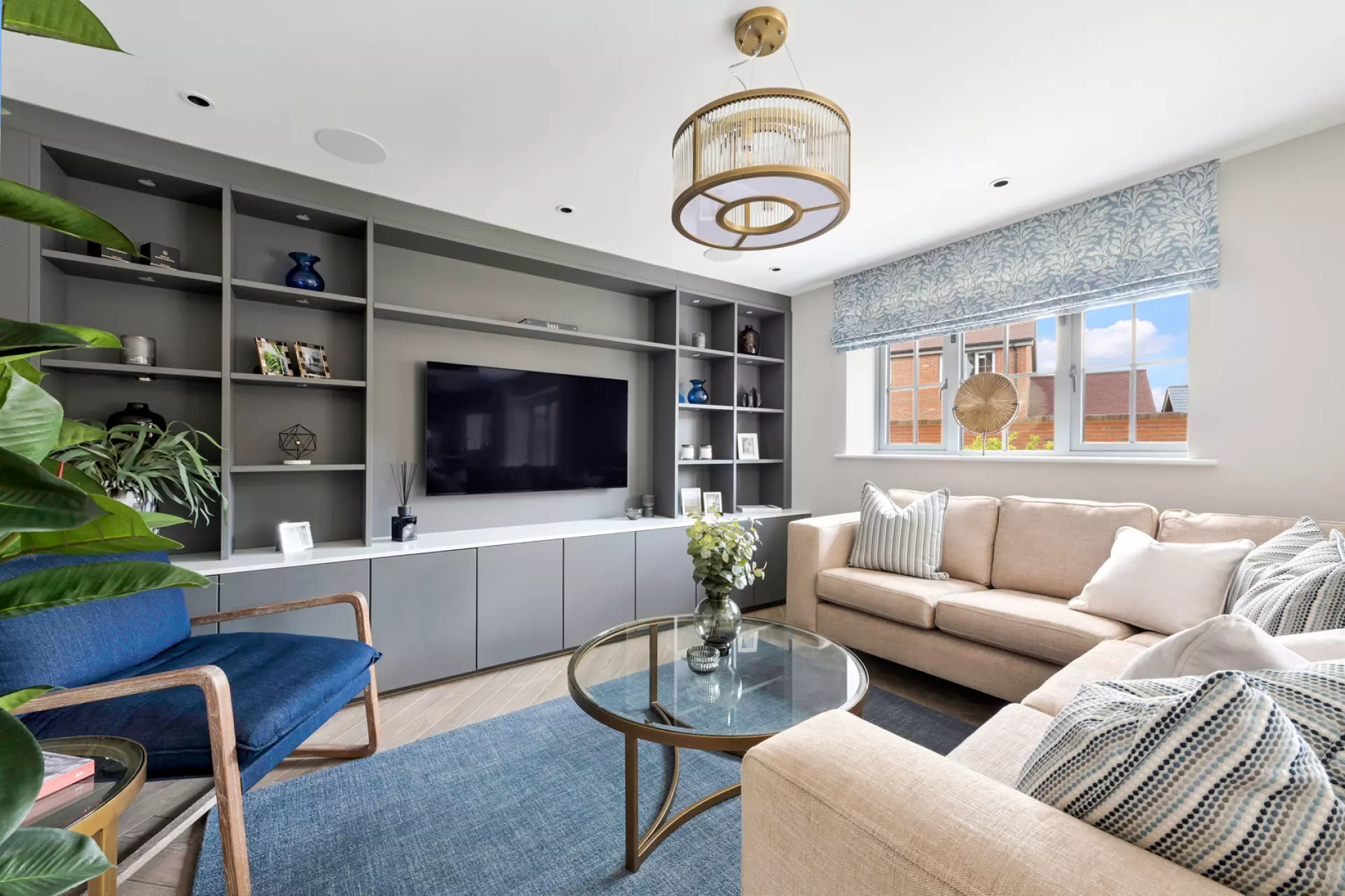 a living room with a tv and couches