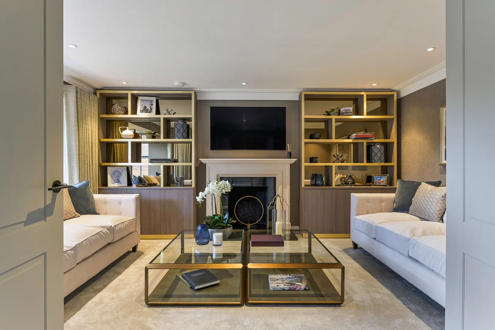 a living room with a fireplace and couches