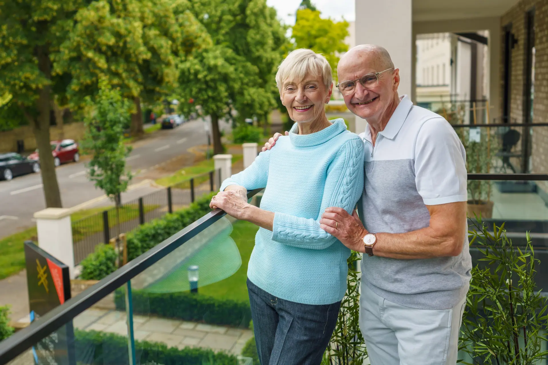 a man and woman standing on a balcony