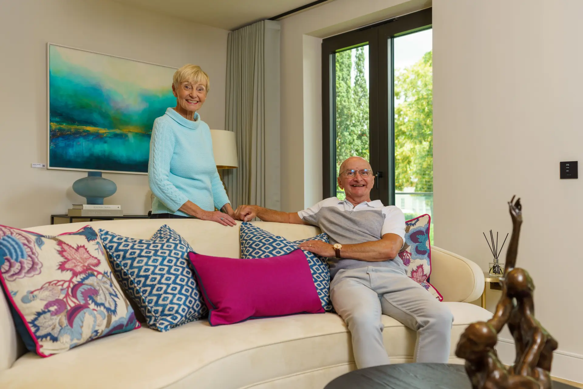 a man and woman sitting on a couch