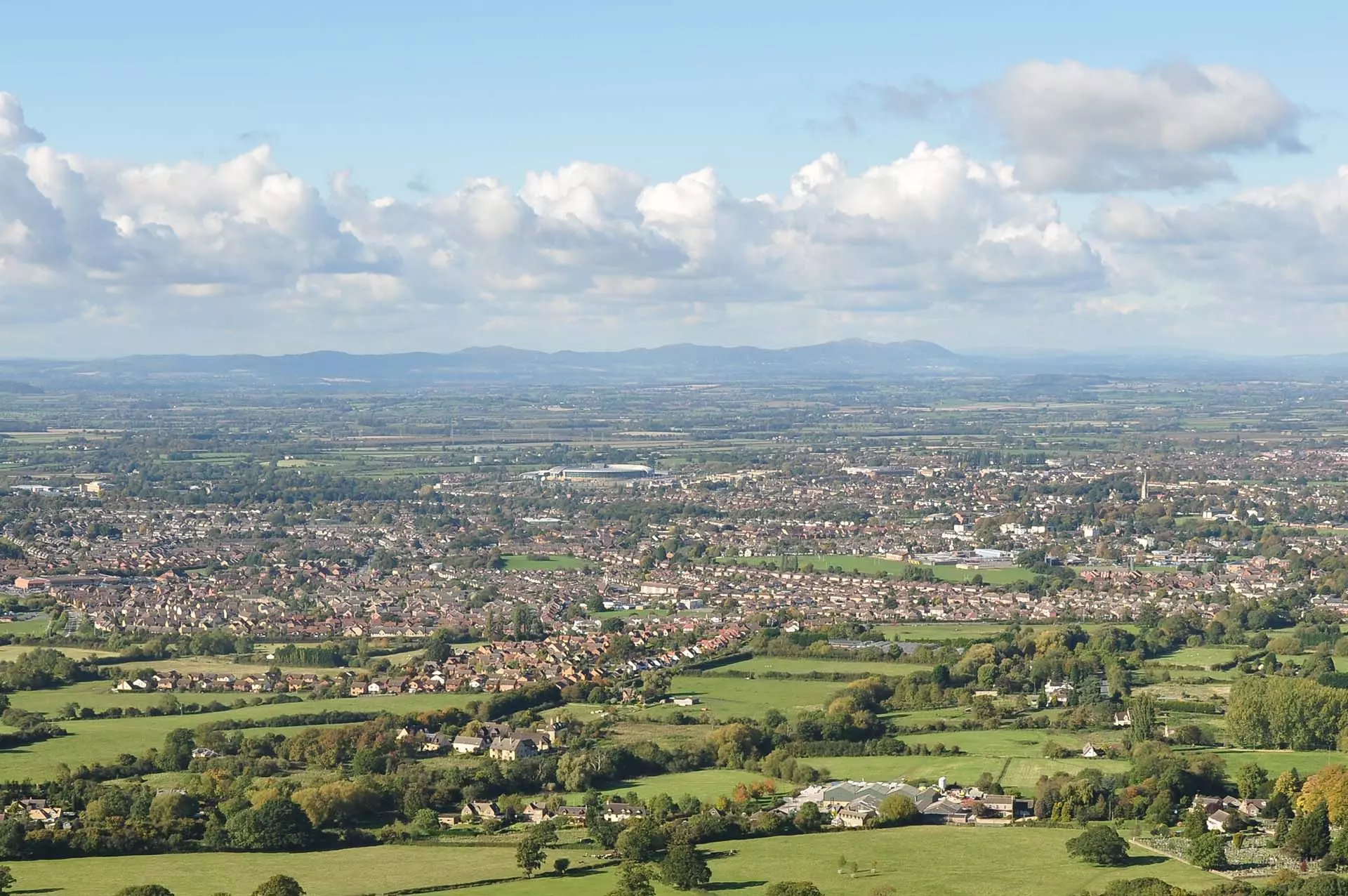a landscape with a city and trees