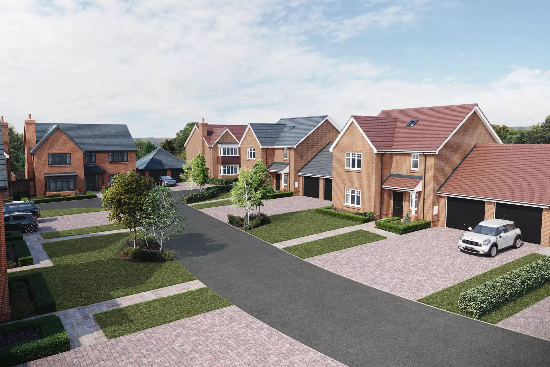 a group of houses with driveways and trees