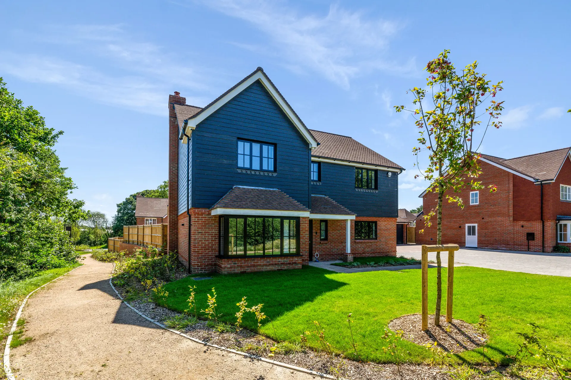 a house with a lawn and a path